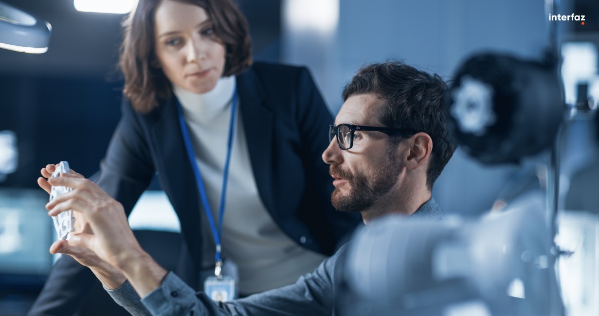 A man showing a woman how innovation is transforming their business