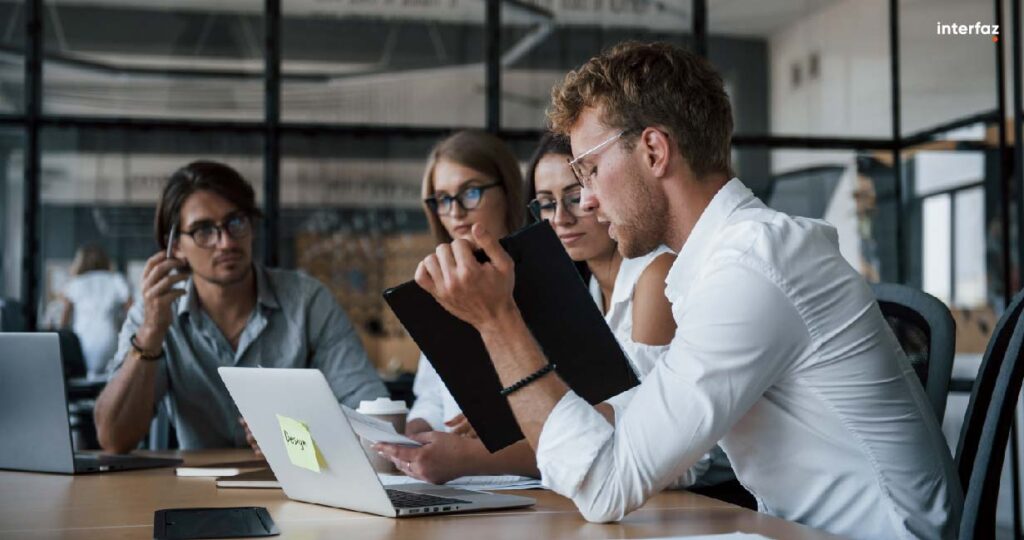 Young business people in formal clothes working in the office